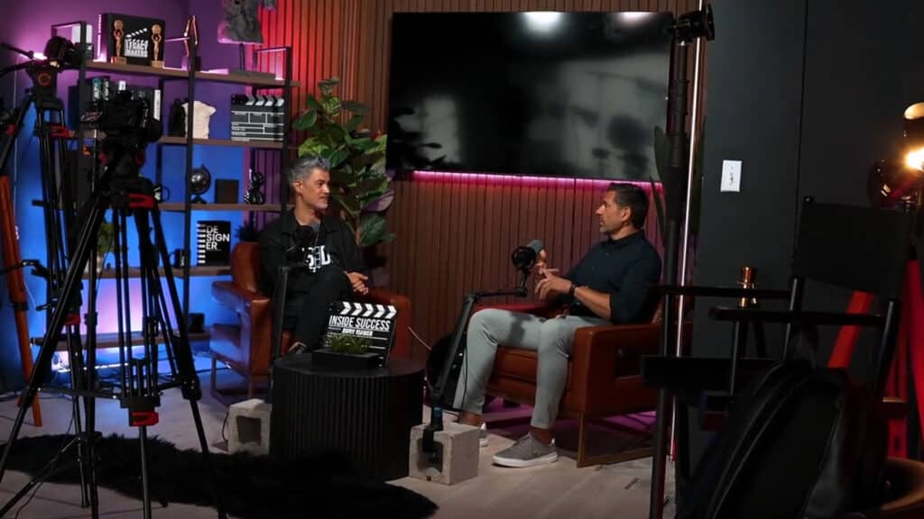 Entrepreneur sitting for a media interview in a broadcast studio