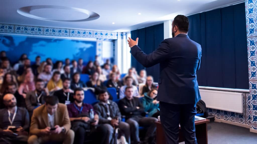 Entrepreneur speaking confidently at a corporate event
