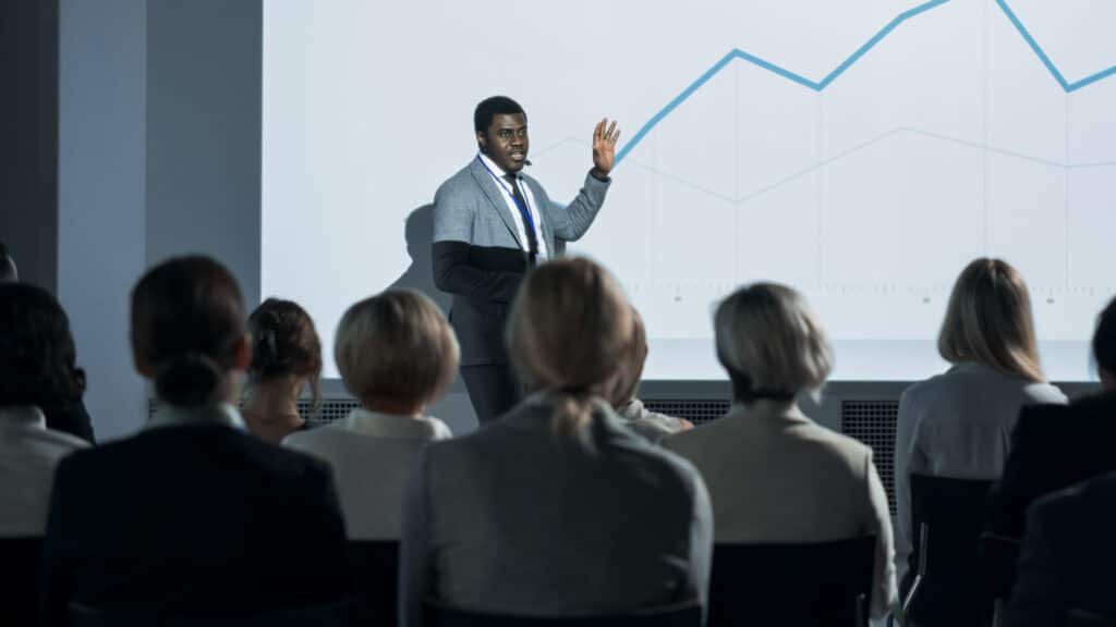 Business leader sharing insights at a conference