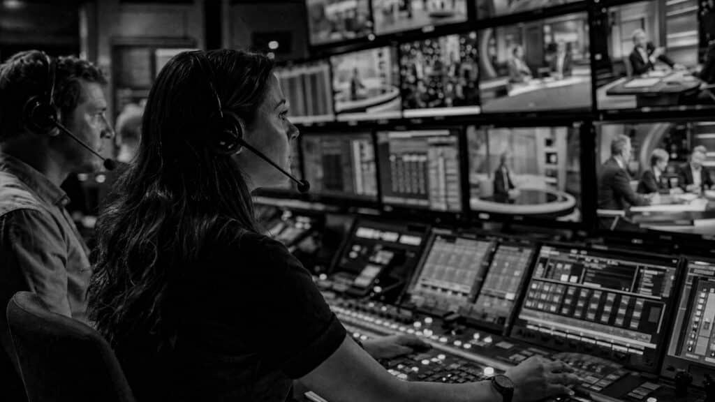 Video editor refining business documentary timeline
